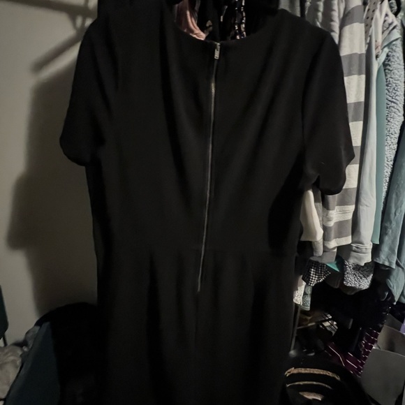 Black short Jessica Simpson dress with attached stones at neckline. - Picture 2 of 3